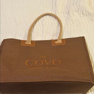 The Cove Paradise Island Brown Tote with Orange Text, 21” x 14”